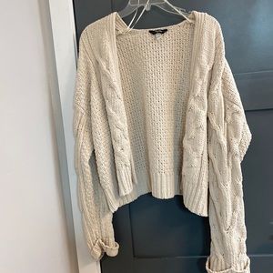 Cream colored cable knit cardigan